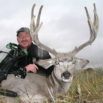 Keith Beam with a Tall Mule Deer in Velvet